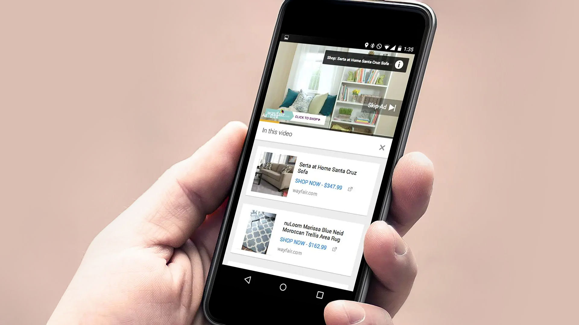 A person holding a smartphone displaying an in-video shopping advertisement for furniture and home decor products with options to shop now.